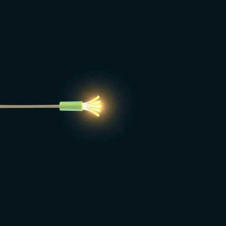 A minimal glass prism refracting a single beam of light from an optical fiber on a dark surface.